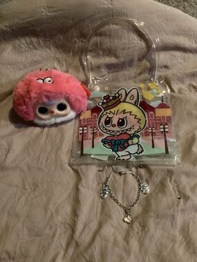 cute keychain smells like strawberry. Handmade charm bracelet and labubu bag.